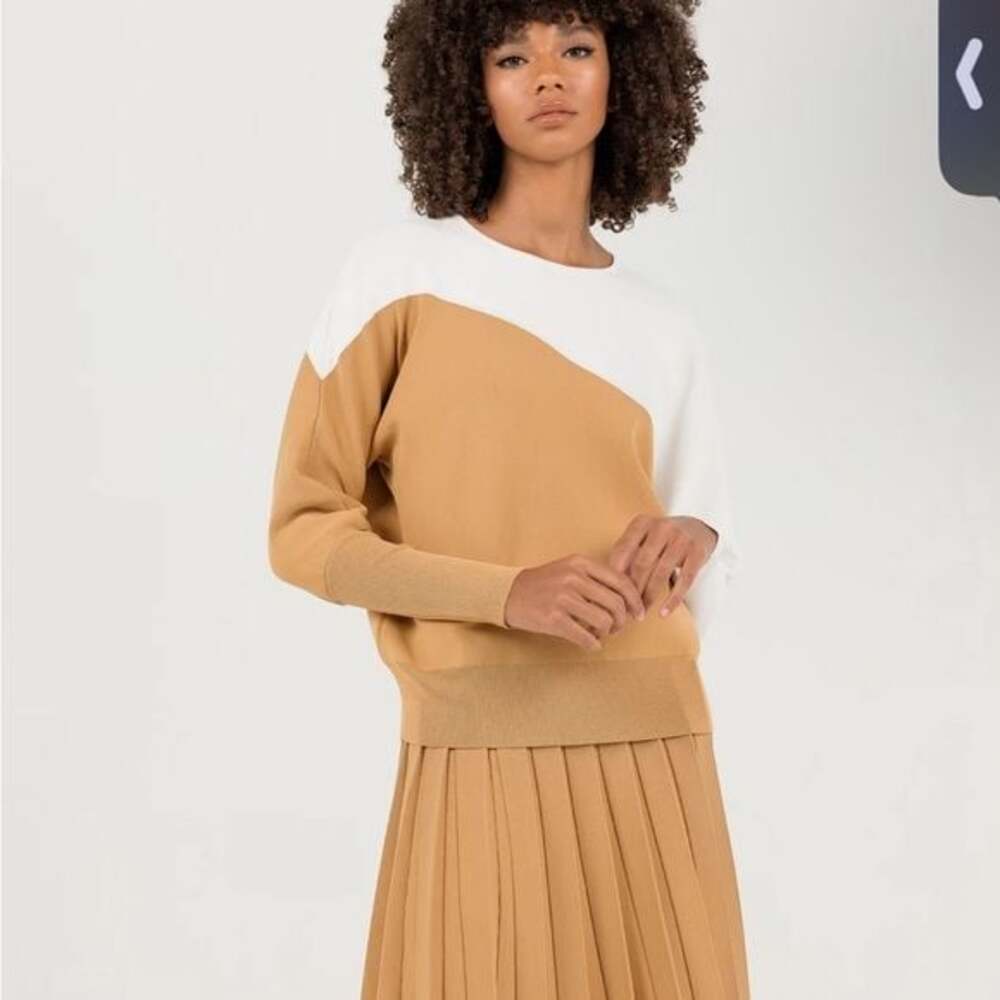Aleeza Paris 27” pleated skirt in Nugget. Matching sweater available